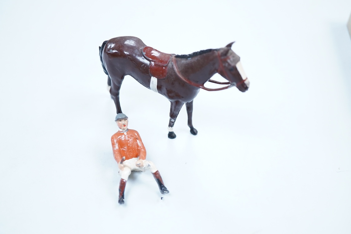 Two boxed Britains Racing Colours of Famous Owners series lead mounted figures; Miss Dorothy Paget - rider in yellow-striped blue jersey on a grey horse, and Msr. M. Boussac - rider in orange jersey on a dark brown horse